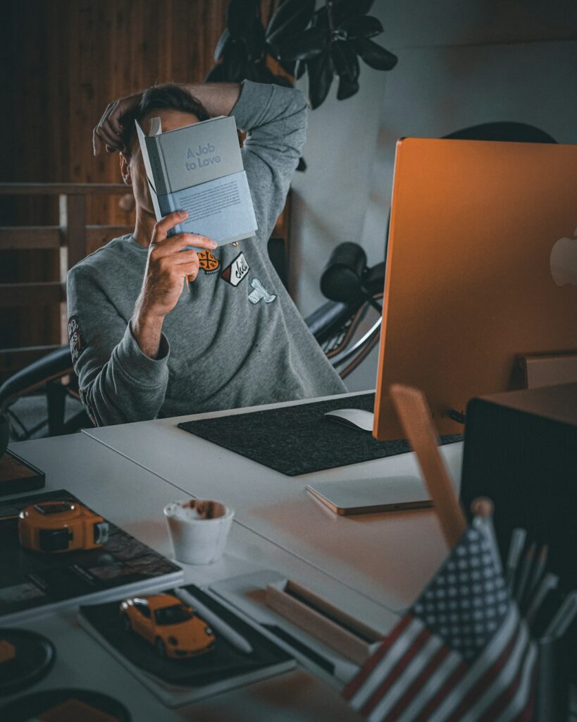 Freelancer organizing receipts, mileage records, and a laptop at a home workspace.